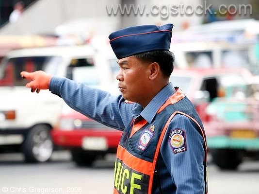 Police Officer in the Philippines Directing Traffic