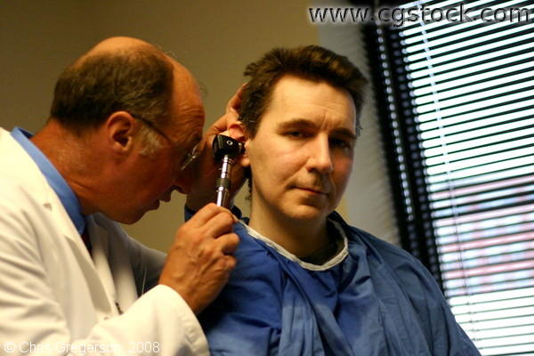 Doctor Examining a Patient's Ear
