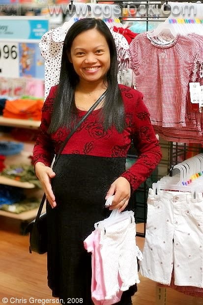 Mother-to-be Shopping for Baby Clothes