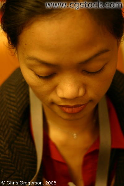 Close-Up of Young Asian Woman Looking Down