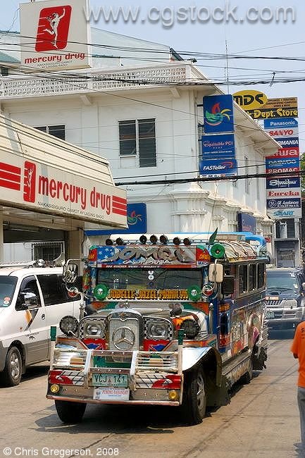 Jeepney Passing Mercury Drug, Vigan