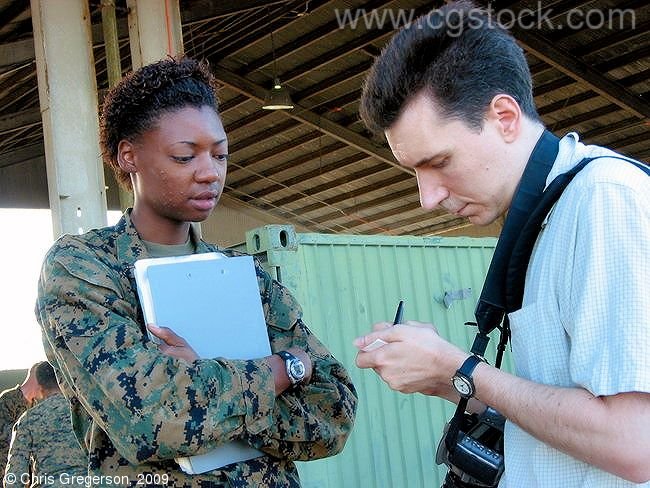 Photographer Taking Notes from Marine Public Information Officer, Philippines