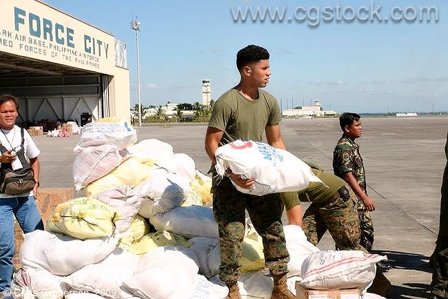 Philippine Air Force Soldier Loading Relief Supplies for Typhoon Victims